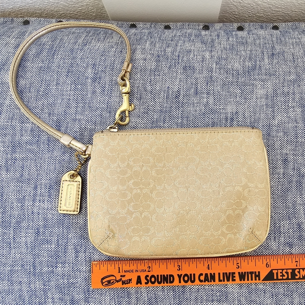 Coach signature C metallic gold wristlet purse